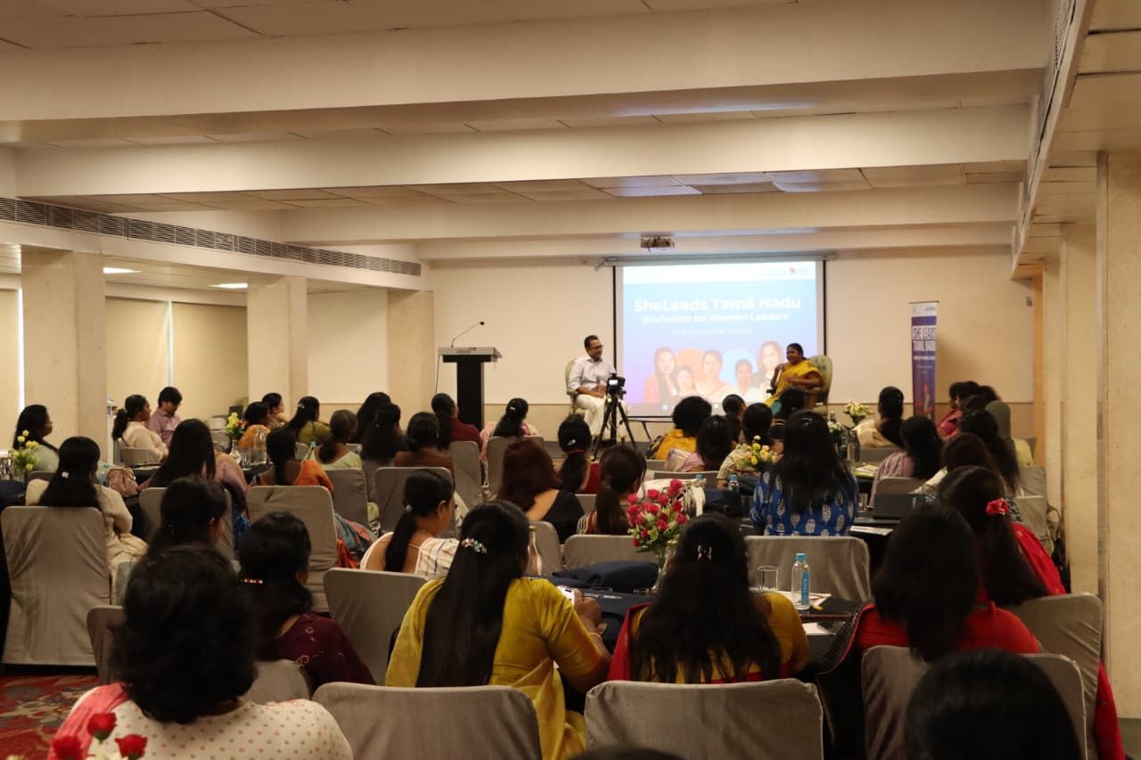 Audience of women leaders watching the session